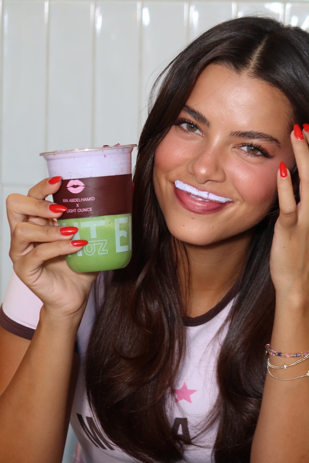 Aya smiling with the Eight Ounce cup