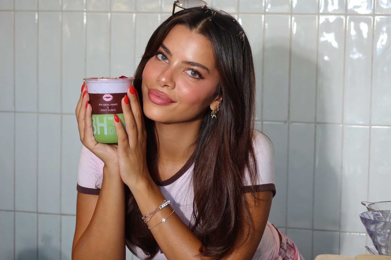 Aya holding the Aya x Eight Ounce matcha cup